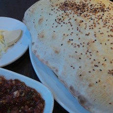 Complimentary starter of puffed bread, spicy veg dip and cheese